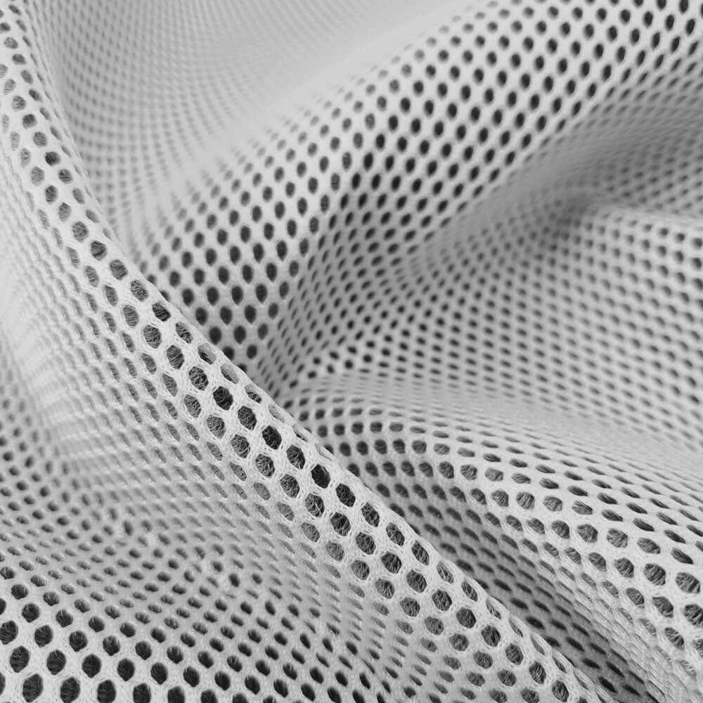 Made-to-order mesh material in white, showcasing its breathable and flexible design.