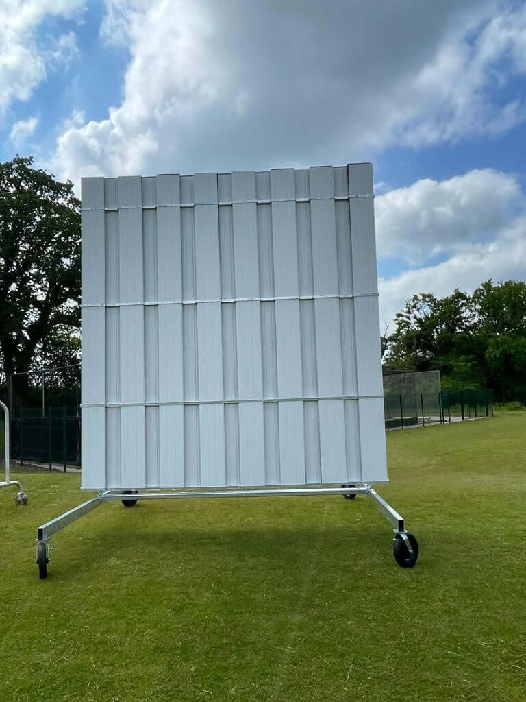 4.5M High X 4M Wide Black And White Swivel Sight Screen on a grassy field