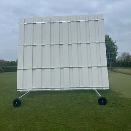 4.5M High X 5.04M Wide Sight Screen on a sports field, showcasing a sturdy PVC design.