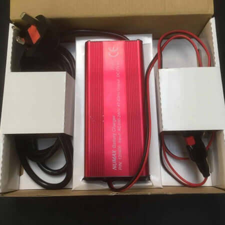 Bola Machine Battery Charger in packaging with cables and mains connection for 12V AGM battery.