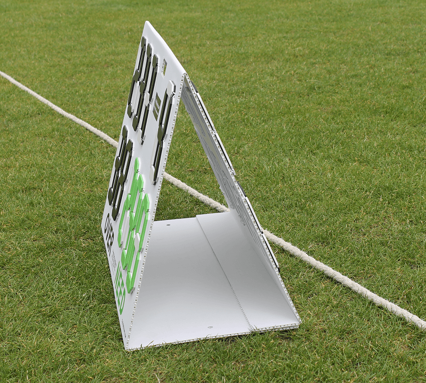 CleverScore Standup Double Sided Manual Cricket Scoreboard displayed on a cricket field.