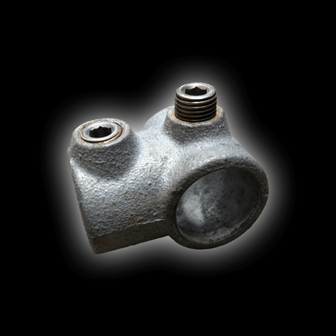 Mobile Cover 2 Way Clamp image showing a metal component with two threaded openings.