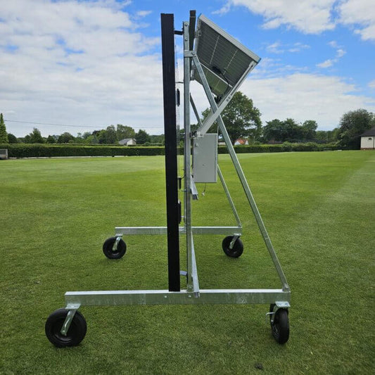 Scoreboard Trolley on a grassy field with puncture proof wheels, ideal for school and club use.