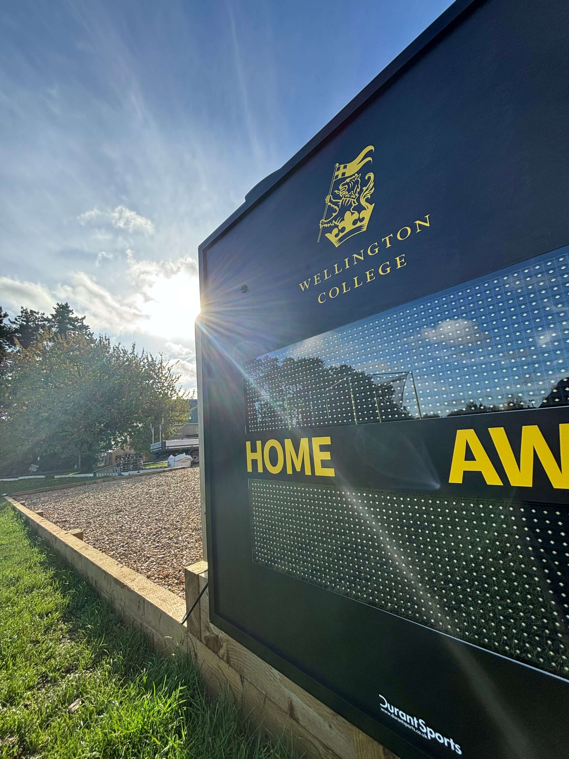 Multi-Sport Scoreboard at Wellington College displaying HOME and AWAY, clear visibility in sunlight.